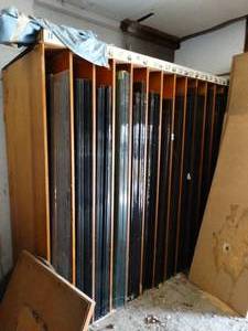 lot 1018 image: Huge Lot of Tempered 4Ft - 6Ft Wide Store Front Door Glass Panels & Rubber Rolls of Weather Stripping
