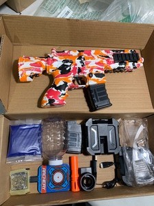 lot 66 image: M416 Gel Ball Blaster Orange Pink Camo w Ammo, Charger, Safety Goggles, and more