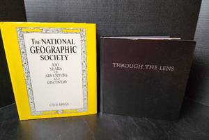 lot 140 image: The National Geographic Society 100 Years of Adventure & Discovery by C.D.B. Bryan - Hardback Book and Through the Lens National Geographic Greatest Photographs - Hardback Book (located in basement)