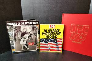 lot 142 image: Life The First 50 Years 1936-1986 - Hardback Book, Life Decades of the 20th Century - Hardback Book, and Life 30 Years of Photography 1960-1990 - Paperback Book (located in basement)