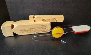 lot 154 image: (2) Wooden Train Whistles and Vintage Toy (located in basement)
