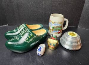 lot 244 image: Wooden Holland Shoes, Porcelain Holland Shoe, Swiss Cow Bell, Beer Stein, Powder Music Box, and More (located in basement)