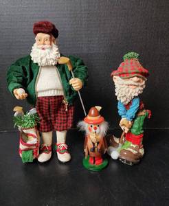 lot 259 image: (2) Golfing Santas (located in basement)