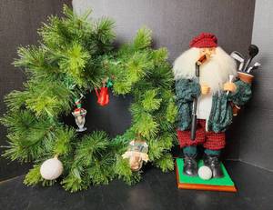 lot 260 image: 18 Golfing Santa, 18 Christmas Wreath, and Ornaments (located in basement)
