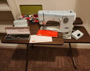 lot 268 image: Elna SU Swiss Sewing Machine, Table, and Accessories (located in basement)