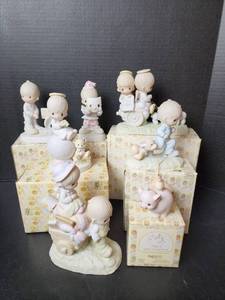 lot 284 image: (7) Vintage Precious Moments Figurines (located in basement)