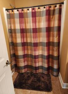 lot 319 image: Contents of Bathroom (Shower Curtain, Trash Can, Tissue Box, Towels, Hot Rollers, Curling Irons, Combs, Body Sprays, Air Fresheners, and More (Located in Basement)