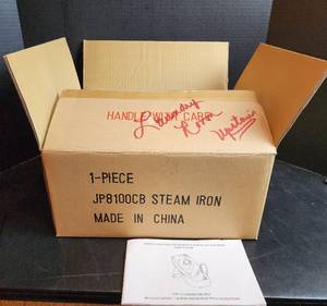 lot 542 image: Oreck Steam Iron NIB