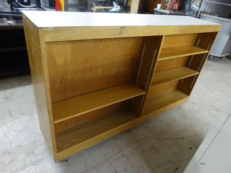 lot 102 image: Double Sided Wood Bookshelf On Wheels - School Furniture.