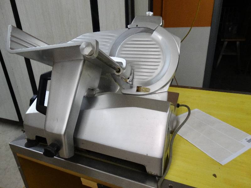 lot 219 image: Univex Model 7510 MeatCheese Slicer WSharpener - Works Good.