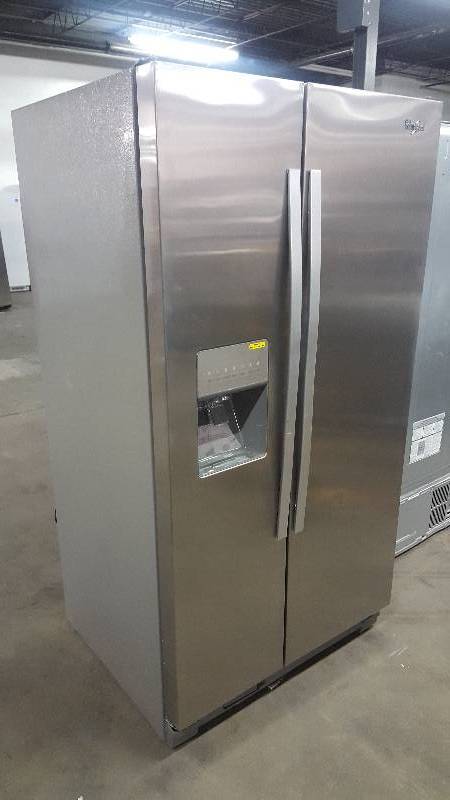 lot 204 image: Whirlpool stainless side by side refrigerator