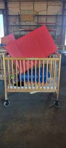 lot 39840 image: Wooden Whitney Evacuation Crib W Assorted Toys