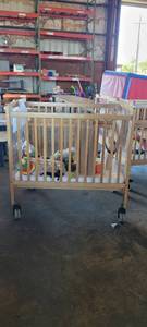 lot 39842 image: Wooden Whitney Evacuation Crib W Assorted Toys