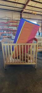 lot 39844 image: Wooden Foudation Fire-Safe Crib W a Lakeshore Mat and a Stuffed Animal