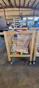 lot 39848 image: Wooden Whitney Evacuation Crib W Assorted Toys