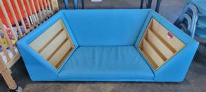 lot 39851 image: Light Blue Lounge Couch W Attached Wooden Magazine Racks