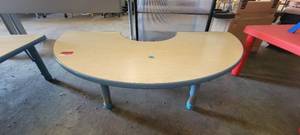 lot 39873 image: Blonde Wood Cresent Shaped Childrens Work Table W a Dark Blue Chair