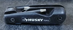 lot 7812 image: Husky 8Pc Multi Tool Blue