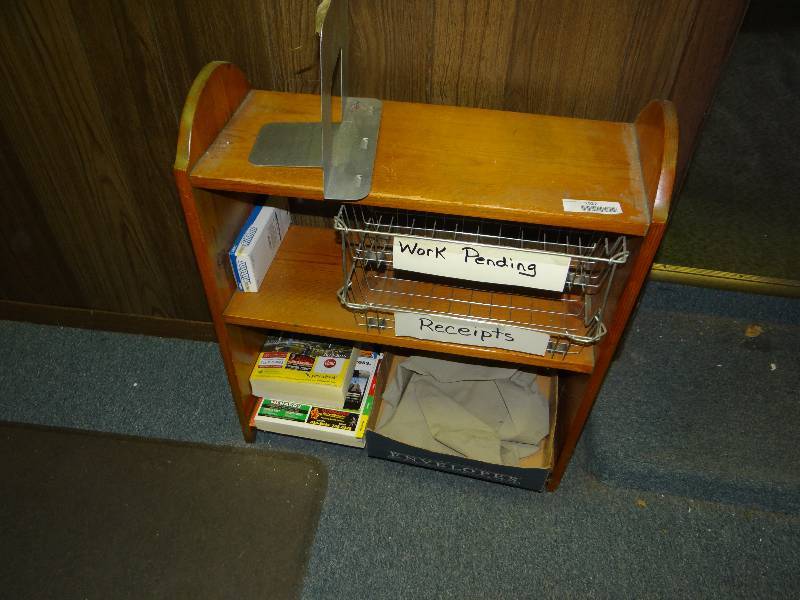 lot 1027 image: 4 Picture Frames, Shelf WContents & 2 Green Trash Can.