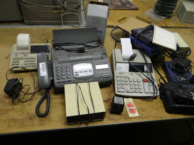 lot 1191 image: All Contents On Table Fax Machine, Adding Machine, Power Strips, Sharp, Typewriter.