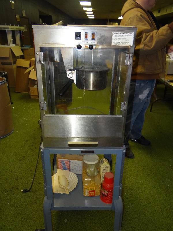 lot 1203 image: Popcorn Machine WStand, WContents Popcorn Bags & Popcorn.