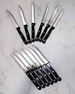 lot 102 image: NEW 12 Piece Set of Pfaltzgraff Everyday Stainless Steak Knives - Black, Three Rivet & Serrated