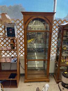 lot 7001 image: Howard miller curio cabinet