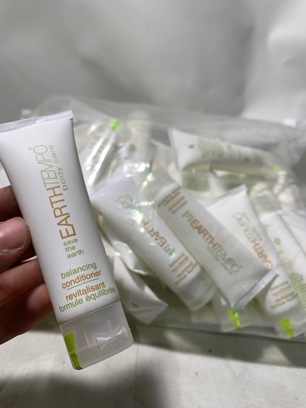 lot 350 image: 1 Giant Bag of 50 EarthTempo Body Care Travel Sized Bottles of Conditioner