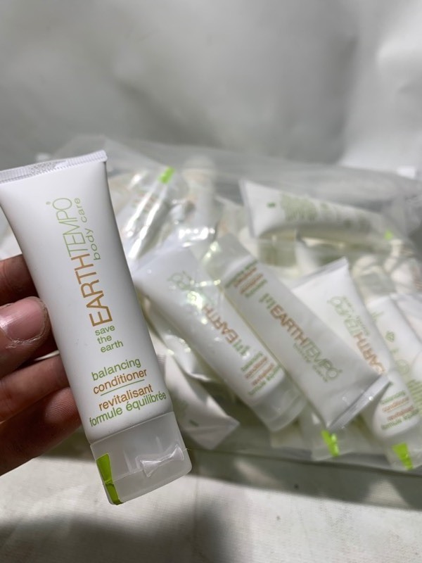 lot 351 image: 1 Giant Bag of 50 EarthTempo Body Care Travel Sized Bottles of Conditioner