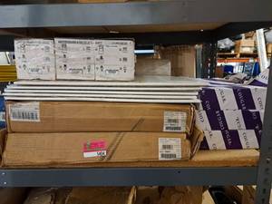 lot 5405 image: Contents of Shelf ( Adapter Test Kits, Vent Covers, Printer Paper)