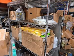 lot 7045 image: 2 Shelves of Contents - Shelf Not Included ( Case of Caulk, Cleaning Solution, Raid)