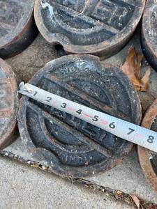 lot 6517 image: 6- Sigma in-ground water utility covers  7 inch diameter front of shop