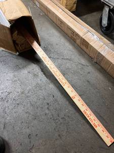lot 4008 image: box of Home Depot yard sticks