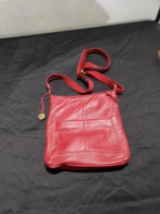 lot 8863 image: The Saturday red leather purse