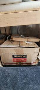 lot 10533 image: Box of Simson Strong Tie JB210A Hangers and a Simpson Strong Tie Coiled Wall Bracing