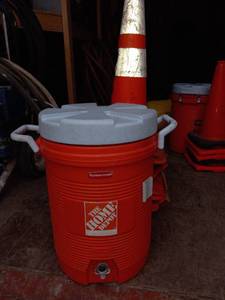 lot 13957 image: Home Depot Rubbermaid 5 gallon water jug with tall work cones