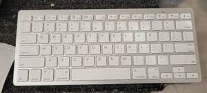 lot 10579 image: Omotion Wireless Keyboard Model KB066