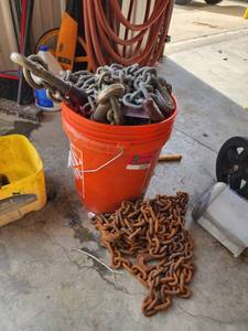 lot 10702 image: Bucket of Chains and Come Alongs