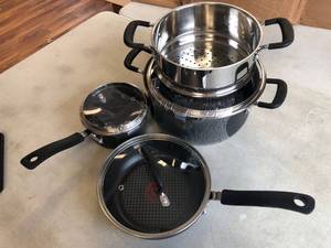 lot 4505 image: T-Fal titanium pots and pan set.