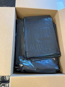 lot 4601 image: 55 gallon black trash bags. At least 50 did not count