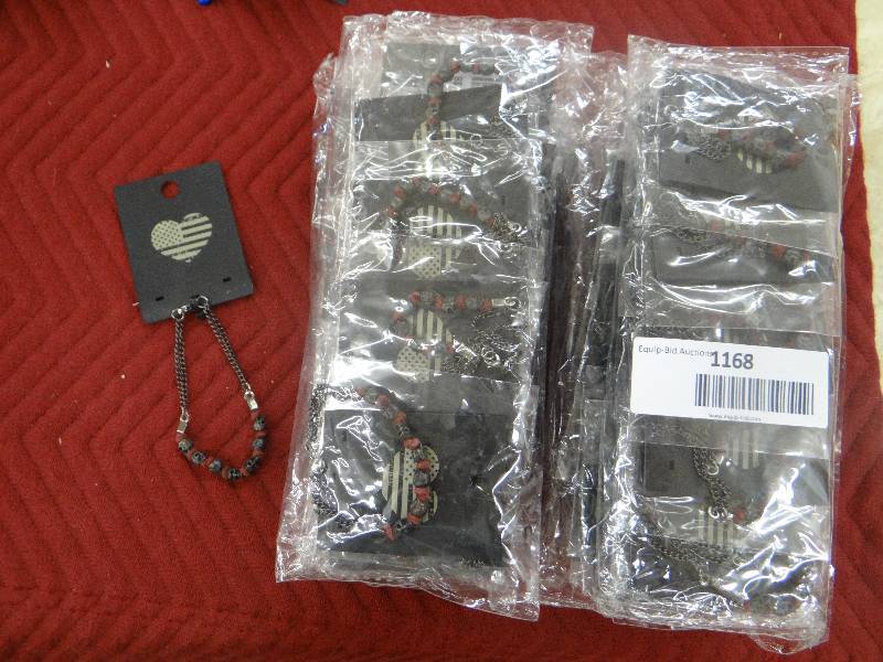 lot 1168 image: Whole sale lot - 60 skull & metal chain bracelets - in packages.