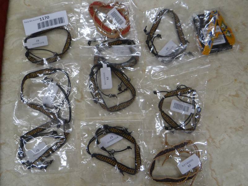 lot 1170 image: Lot of beaded cord bracelets in packages.