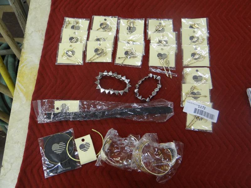 lot 1172 image: Large jewelry lot. 18pr. arrow earrings, 3 spike bracelets, 3 gold cuff bracelets, 1 bangle bracelet.