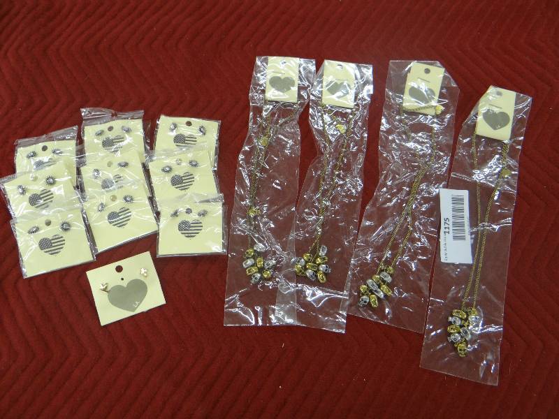lot 1175 image: Lot of jewelry 10pr. earrings, 4 goldsilver skull necklaces.