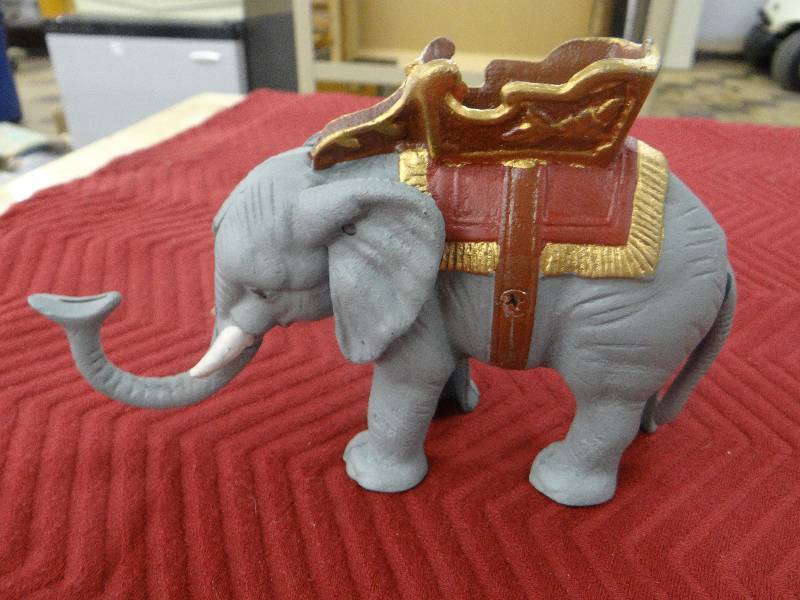 lot 1184 image: Painted iron elephant bank - spring action.