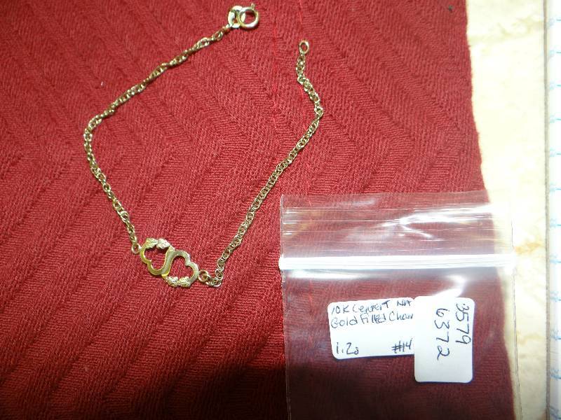 lot 1122 image: 10k Tri-gold hearts on gold filled chain bracelet.
