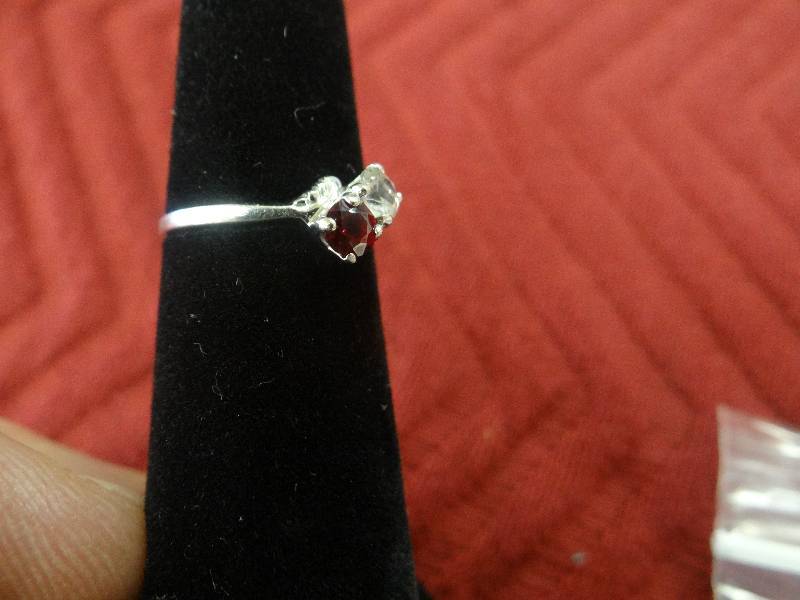 lot 1131 image: 10K white gold ring wruby & clear spinel stones.