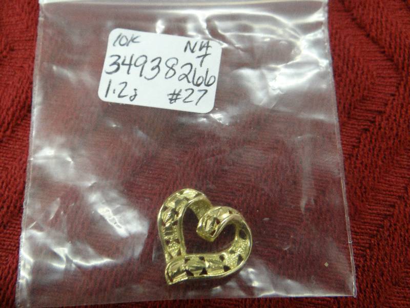 lot 1137 image: 10K gold filigree heart pendent.