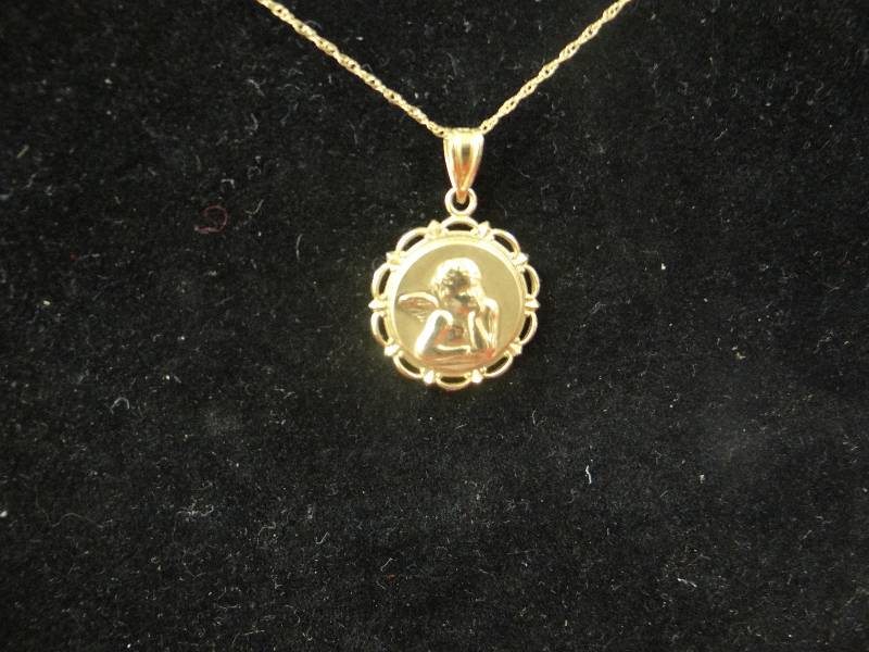 lot 1141 image: 14K gold cherub medallion necklace w18 chain.