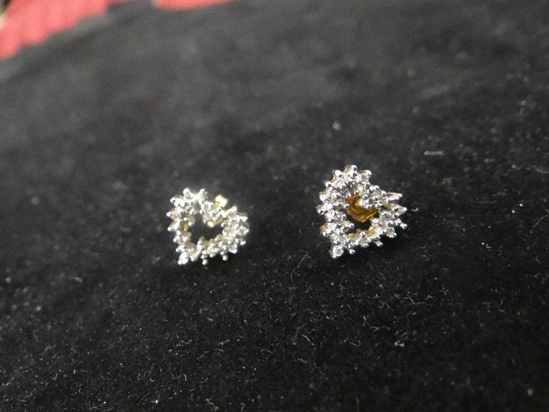 lot 1144 image: 10K gold & diamond heart post earrings.